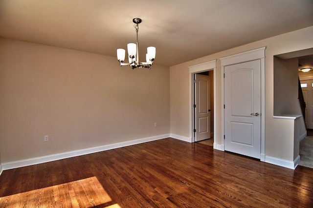 411 Pierce Ln, East Stroudsburg, PA 18301 - spare room with a chandelier, dark wood-style flooring, and baseboards