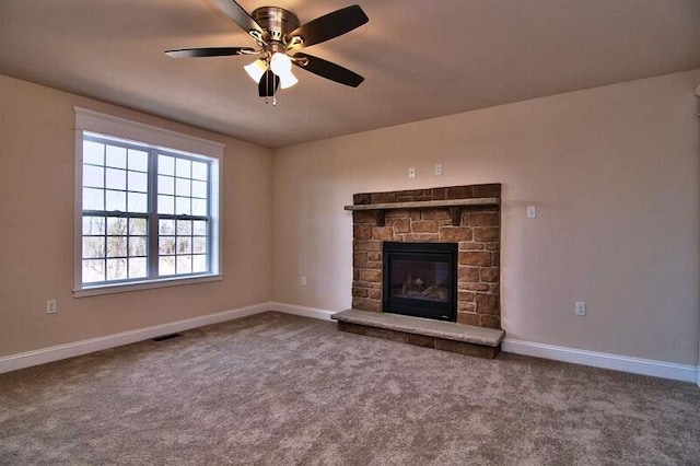 411 Pierce Ln, East Stroudsburg, PA 18301 - unfurnished living room with carpet flooring, baseboards, ceiling fan, and a fireplace