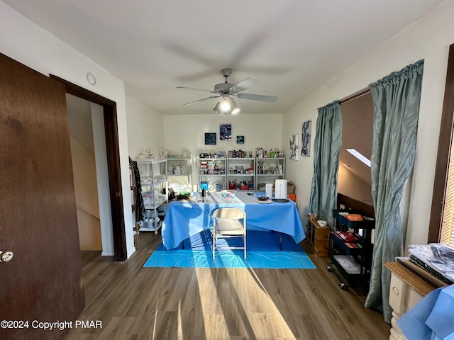 dining area featuring a ceiling fan and wood finished floors