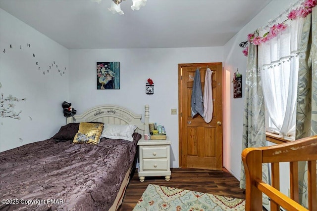 bedroom featuring dark wood-type flooring