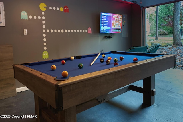 rec room with pool table and concrete floors