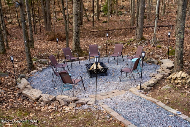 view of patio with a fire pit