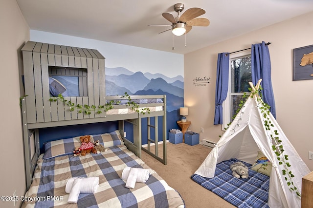 bedroom with a baseboard radiator, ceiling fan, and carpet flooring