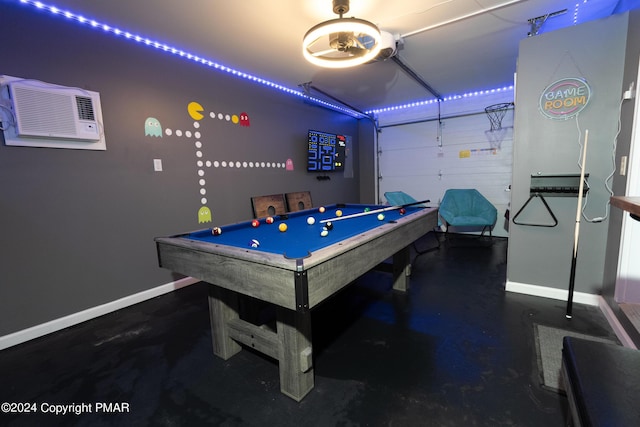 recreation room with a garage, finished concrete floors, baseboards, and pool table