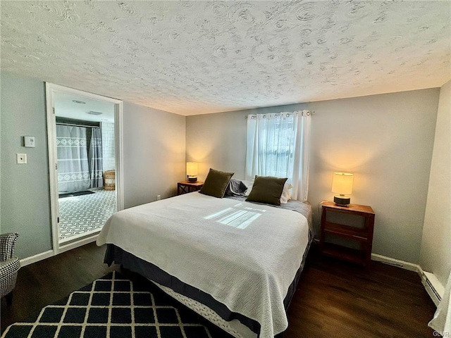 bedroom with baseboards, a textured ceiling, and wood finished floors