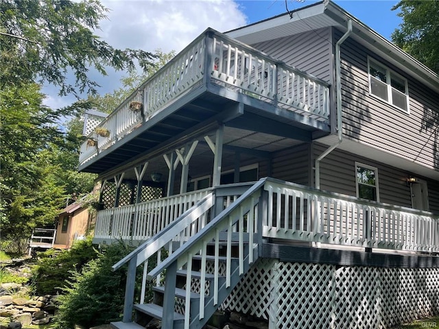 back of property with stairs