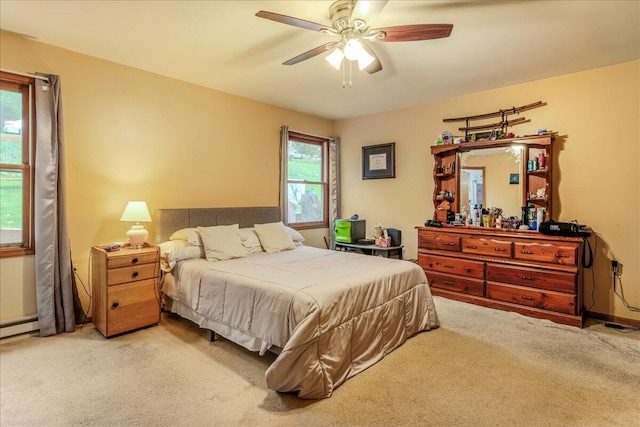 225 Northpark Dr W, East Stroudsburg, PA 18302 - carpeted bedroom with ceiling fan and a baseboard heating unit