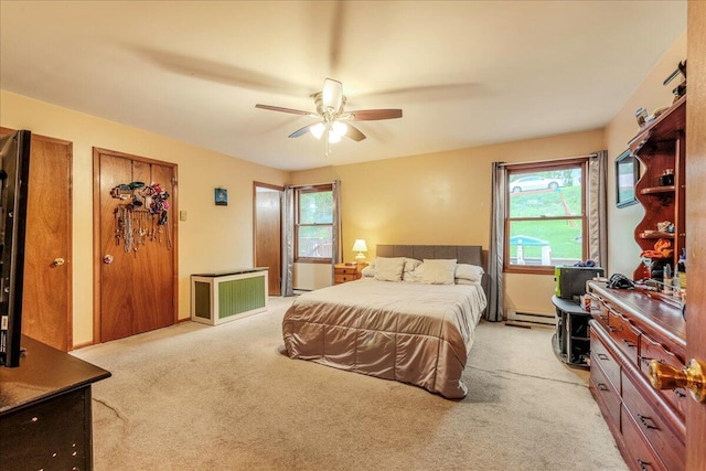225 Northpark Dr W, East Stroudsburg, PA 18302 - bedroom with a baseboard heating unit, light carpet, and ceiling fan