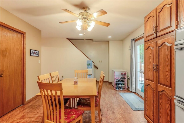 225 Northpark Dr W, East Stroudsburg, PA 18302 - dining space featuring light wood-type flooring, a ceiling fan, and stairs