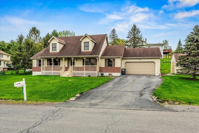 225 Northpark Dr W, East Stroudsburg, PA 18302 - cape cod-style house with covered porch, driveway, a garage, and a front lawn