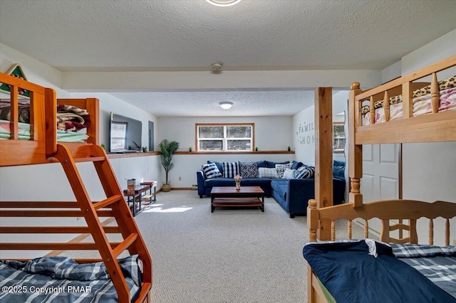 bedroom with carpet flooring and a textured ceiling