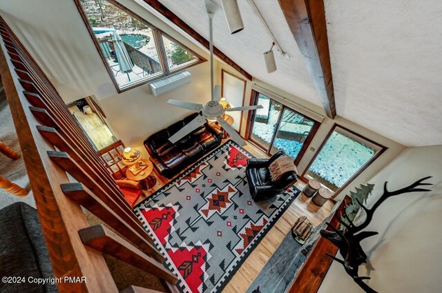 living room featuring wood finished floors and a ceiling fan