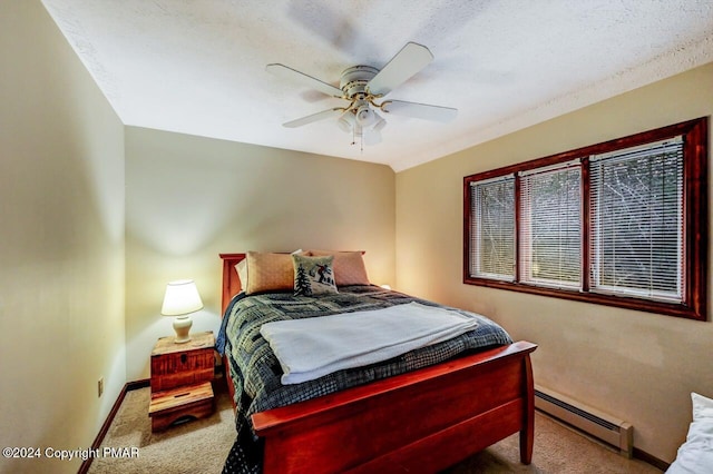 carpeted bedroom with a ceiling fan, baseboards, and baseboard heating