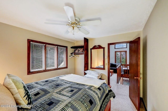 bedroom with ceiling fan and carpet floors