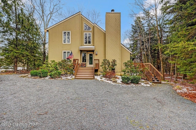 view of front of home featuring a chimney