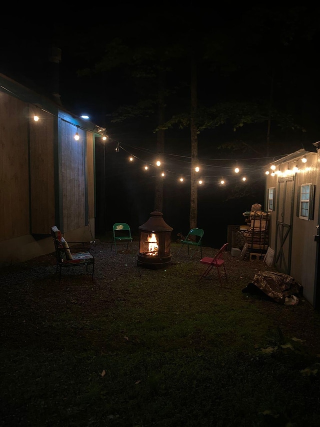 38 N Fairway Dr, Lake Ariel, PA 18436 - yard at night with a fire pit