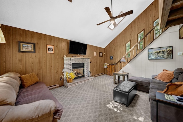 38 N Fairway Dr, Lake Ariel, PA 18436 - living area with ceiling fan, wooden walls, lofted ceiling, a baseboard radiator, and stairway