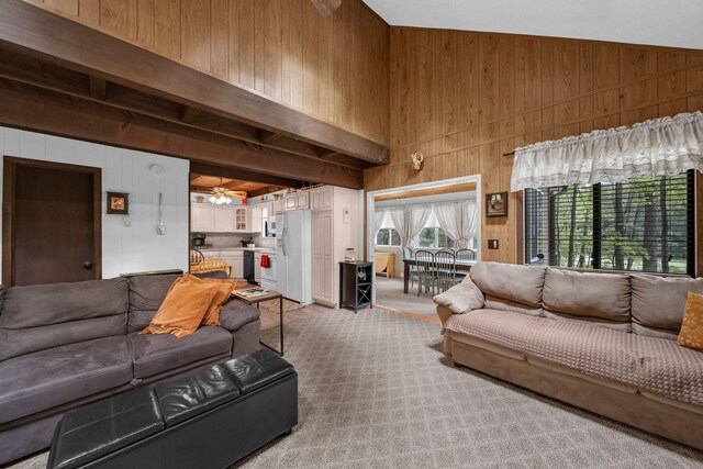 38 N Fairway Dr, Lake Ariel, PA 18436 - living room with wooden walls, ceiling fan, and a towering ceiling