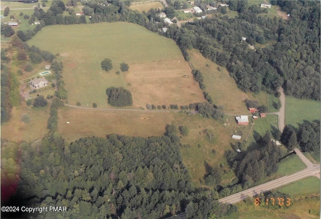 drone / aerial view with a rural view and a view of trees