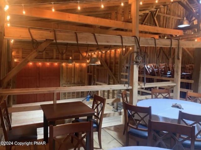 dining space featuring lofted ceiling