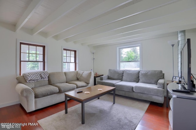 living room featuring beamed ceiling, wood finished floors, and baseboards