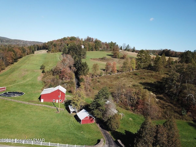 birds eye view of property with a rural view