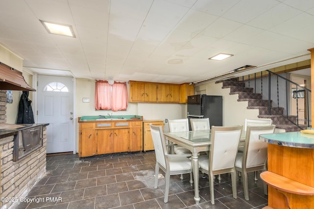 kitchen with black fridge and sink