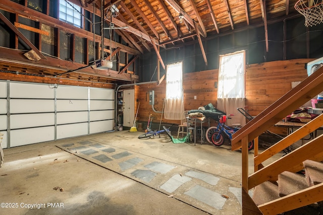 garage featuring a garage door opener and electric panel