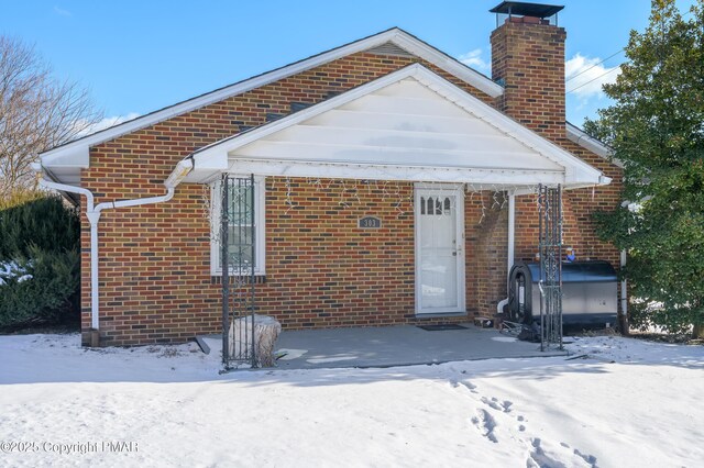 view of snow covered house