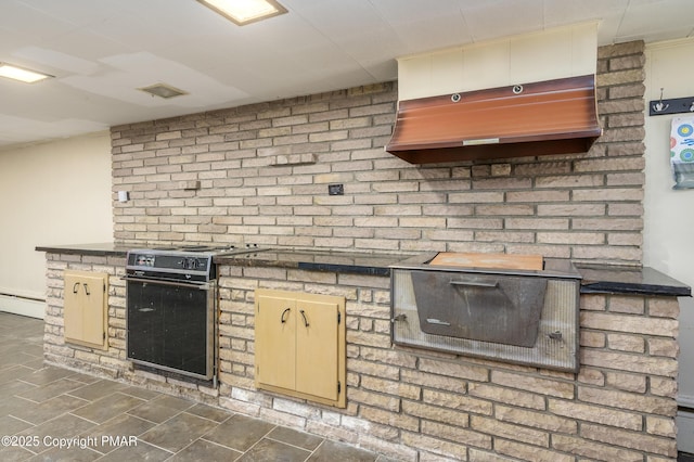 kitchen with a baseboard radiator and stove