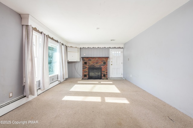 unfurnished living room featuring light carpet and a brick fireplace