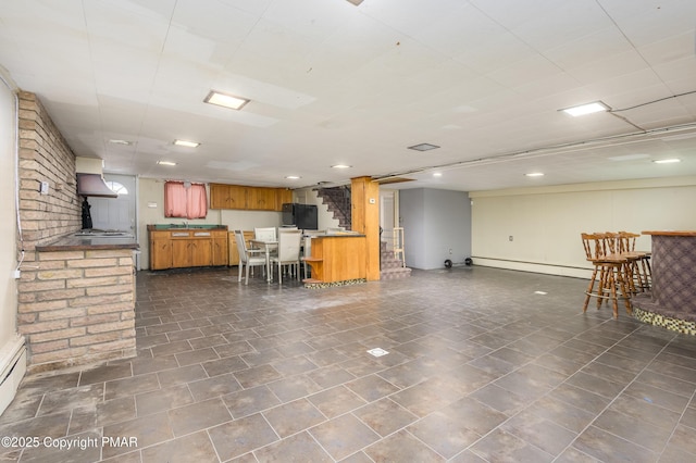 interior space featuring a baseboard radiator and indoor wet bar