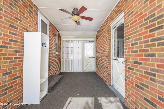 exterior space featuring ceiling fan