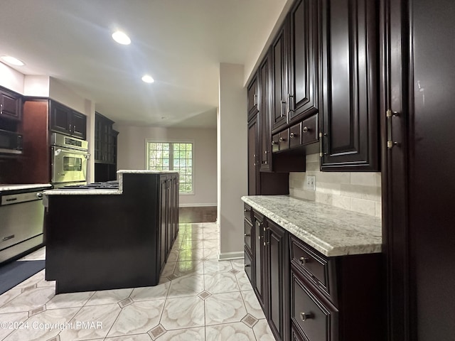 kitchen featuring stainless steel appliances, recessed lighting, backsplash, light tile patterned flooring, and baseboards