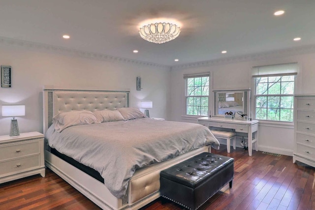 bedroom with dark wood-type flooring, recessed lighting, and baseboards