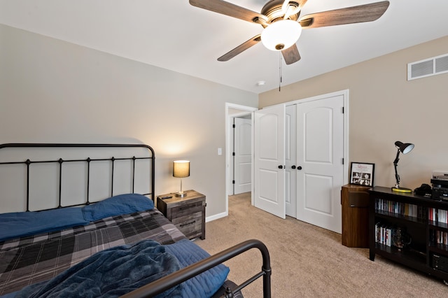 bedroom featuring baseboards, visible vents, ceiling fan, carpet flooring, and a closet