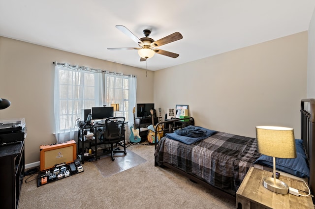 bedroom featuring a ceiling fan, carpet, and baseboards