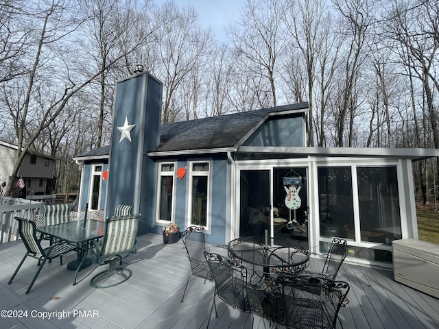 wooden deck featuring outdoor dining space