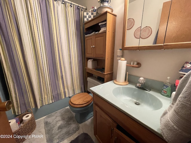 bathroom featuring vanity, toilet, and shower / tub combo with curtain