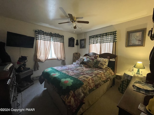 bedroom featuring carpet floors, multiple windows, and a ceiling fan