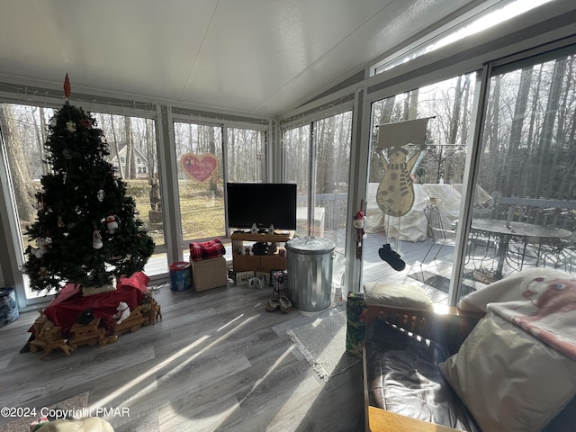 sunroom / solarium with lofted ceiling