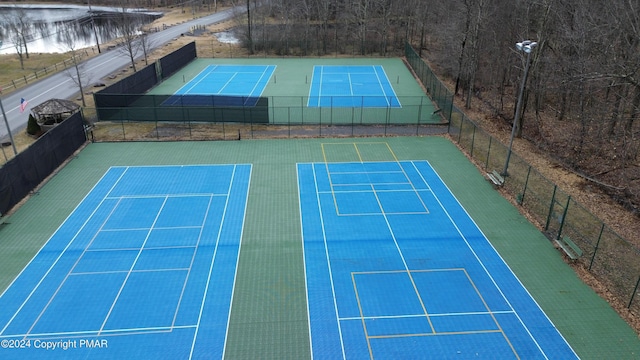 view of sport court with fence