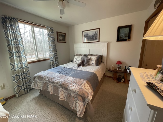 bedroom featuring carpet floors, baseboards, and a ceiling fan