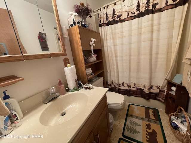 full bathroom featuring toilet, shower / bath combo, vanity, and tile patterned floors