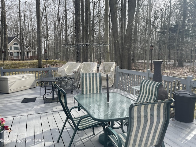 wooden deck featuring outdoor dining space