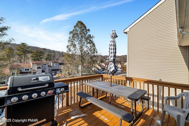 wooden terrace featuring grilling area