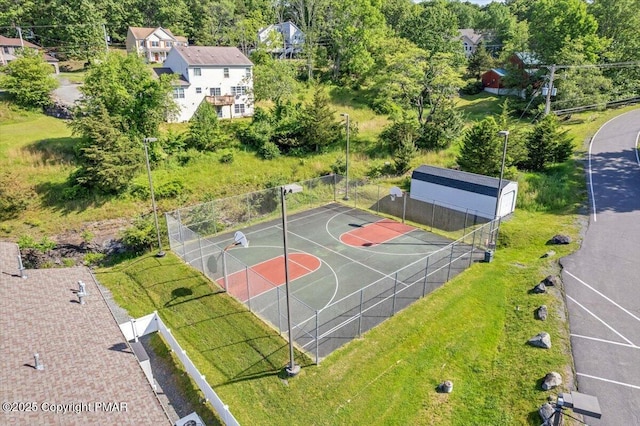 view of basketball court featuring community basketball court and fence