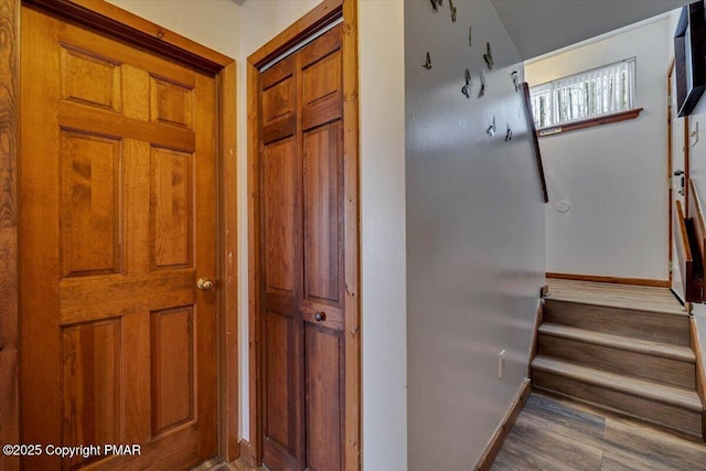 stairs with baseboards and wood finished floors