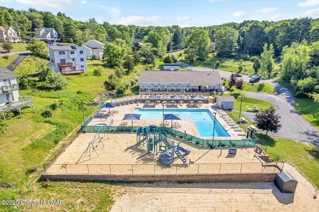 community pool featuring fence