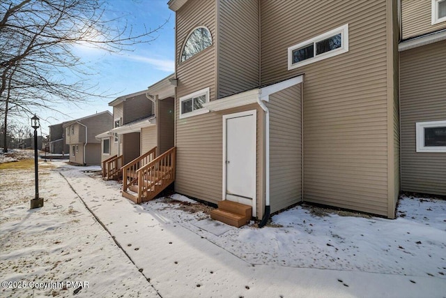 exterior space featuring entry steps and a residential view